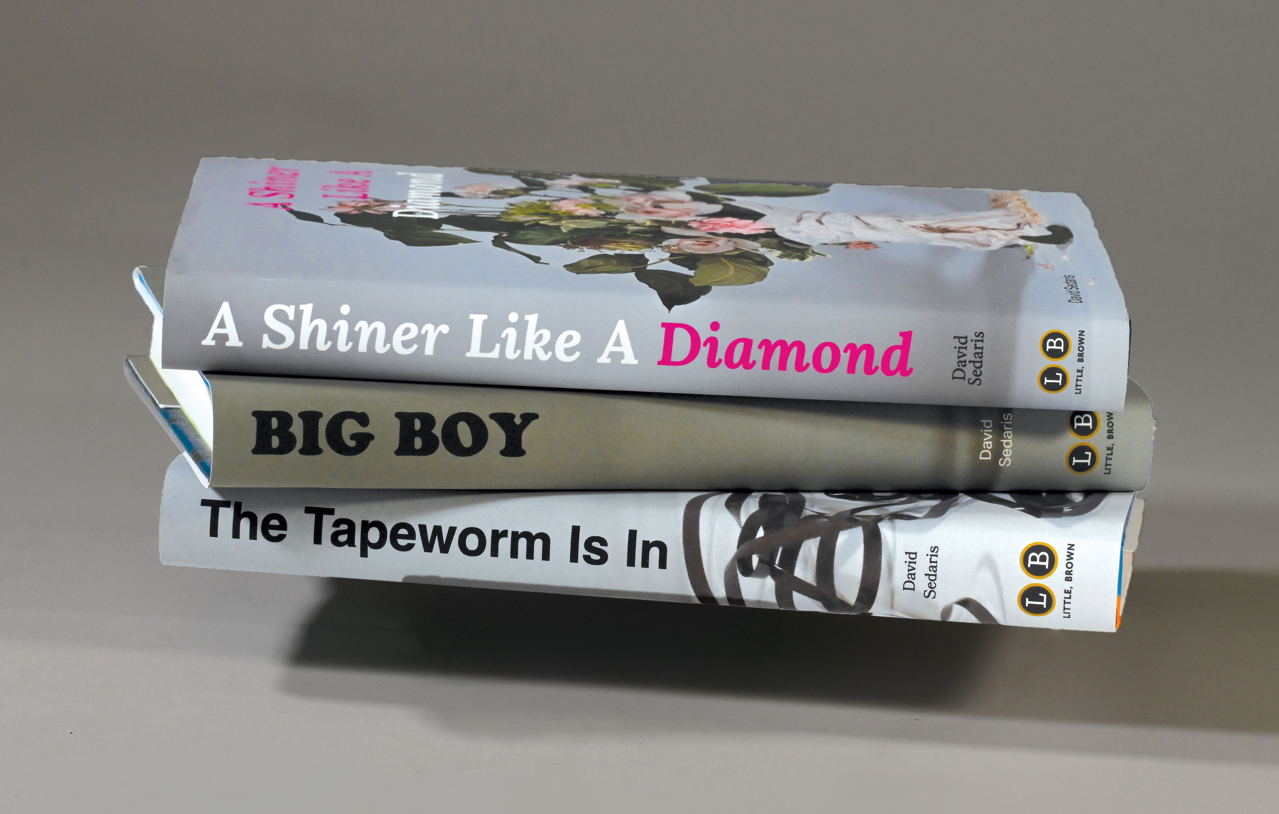 image of the back of 3 bookcovers